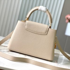 CAPUCINES BB 27CM BEIGE TAURILLON LEATHER