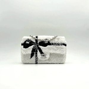 CC 25S FLAP BAG 20 CM IN WHITE SEQUINS WITH BLACK BOW