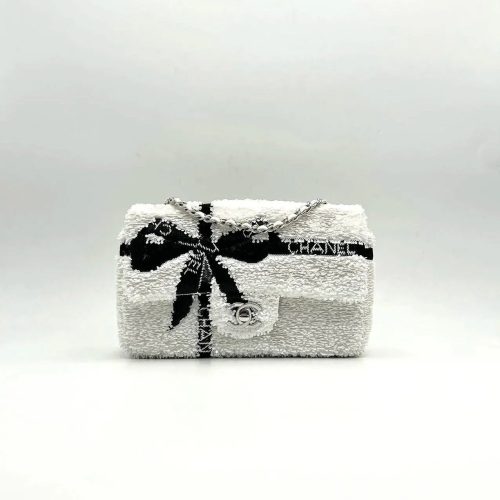 CC 25S FLAP BAG 20 CM IN WHITE SEQUINS WITH BLACK BOW