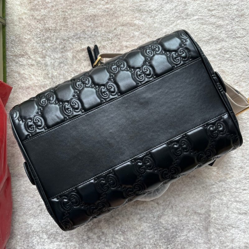 20220803_i1659505283_2913_4_jpg MATELASSÉ TOP HANDLE BAG 31 IN BLACK EMBOSSED CALFSKIN GOLD HARDWARE