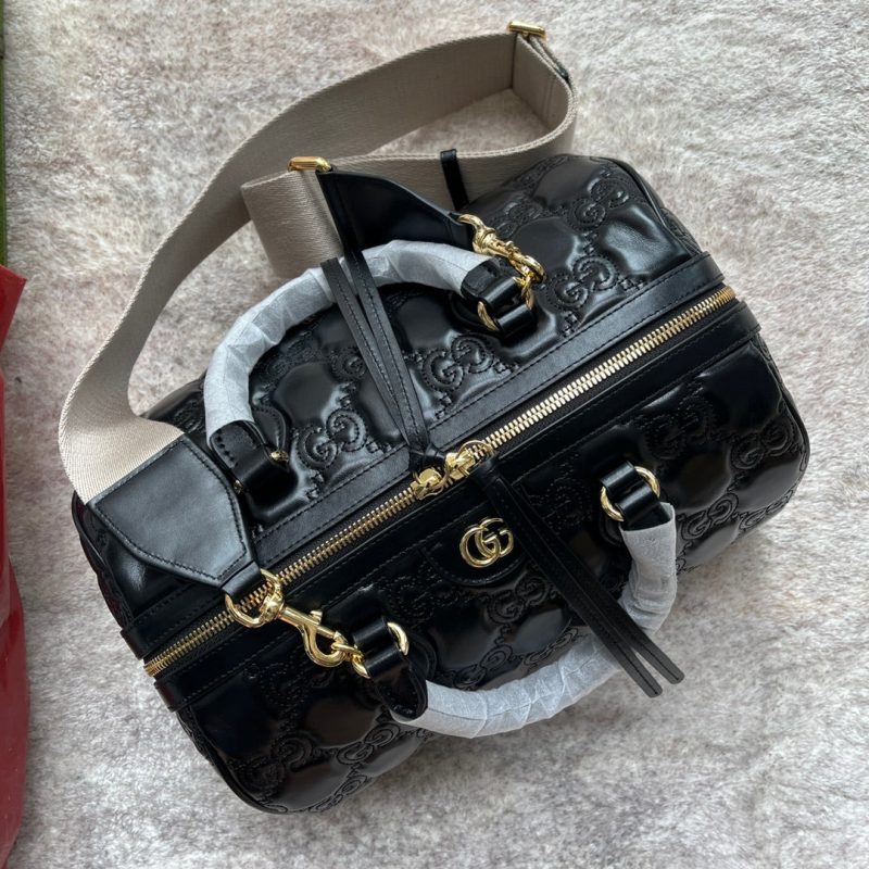 20220803_i1659505283_6129_2_jpg MATELASSÉ TOP HANDLE BAG 31 IN BLACK EMBOSSED CALFSKIN GOLD HARDWARE